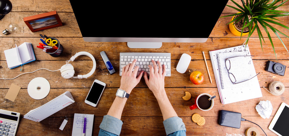 two dumplings on a wood plate with chopsticks